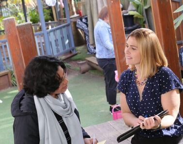 Bel and educator talking outside with resource 1 2021 02 25 010753 1