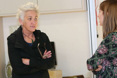 Emma with educator indoors