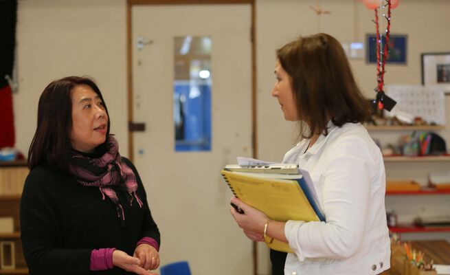 Mika and educator educator talking